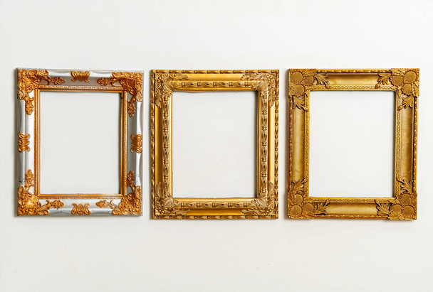 empty picture frame on white wall background with copy space - 写真・画像