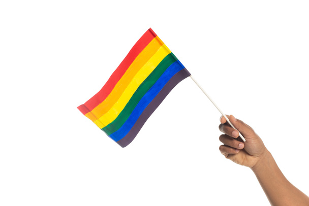 partial view of african american man holding small lgbt flag isolated on white - Fotoğraf, Görsel