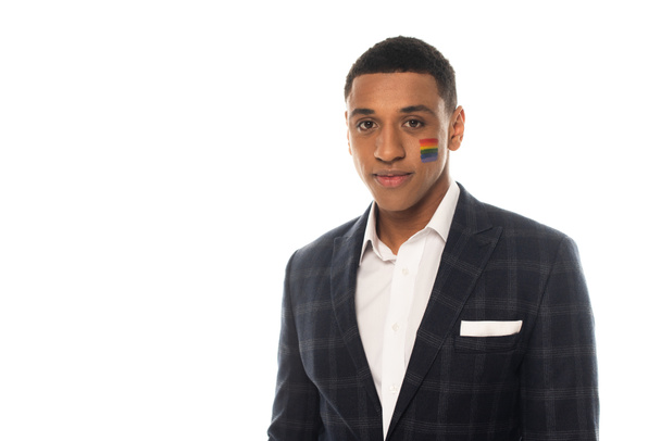 young african american businessman with lgbt flag painted on face isolated on white - Photo, Image
