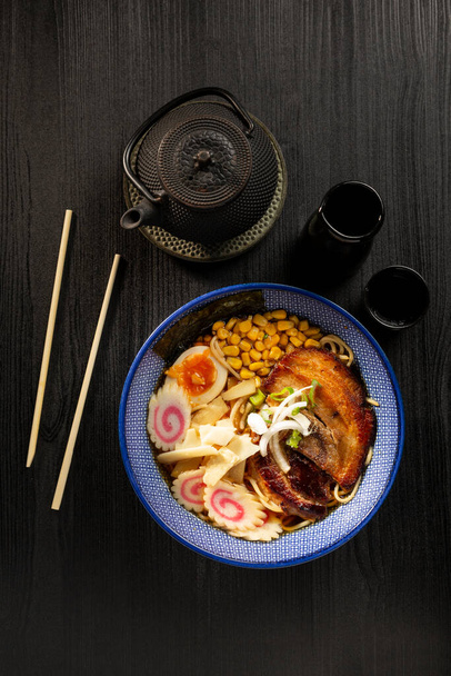 Japanese miso ramen soup on dark background viewed from above. Japanese noodles. - Photo, Image