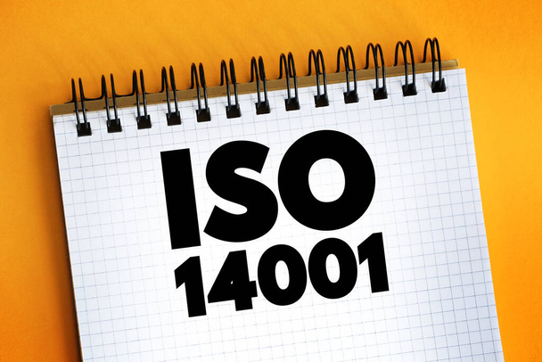 ISO 14001国際標準テキストon notepad, Concept backgrown - 写真・画像