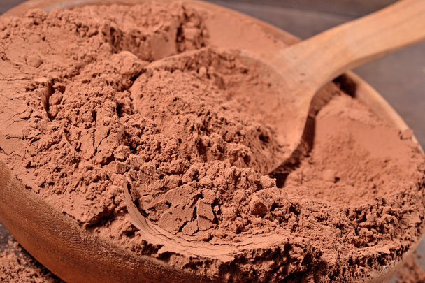 cacao en polvo en una cuchara
 - Foto, imagen