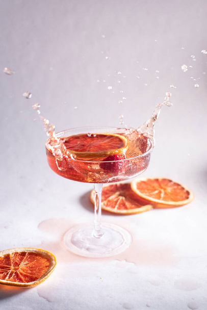 Rose champagne splashing on a light background - Foto, Imagem