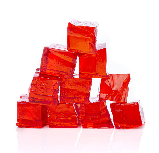 Cubes of red strawberry jelly on a white background - Photo, Image