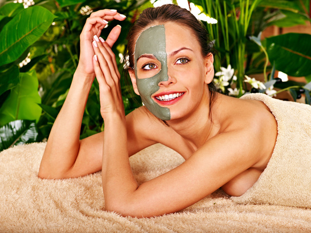 Clay facial mask in beauty spa. - Photo, Image