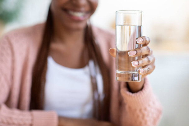 Unrecognizable Black Woman Offering Glass Of Water To Camera - Φωτογραφία, εικόνα