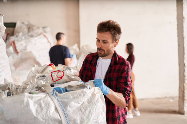Man working at the waste recycling plant - Zdjęcie, obraz