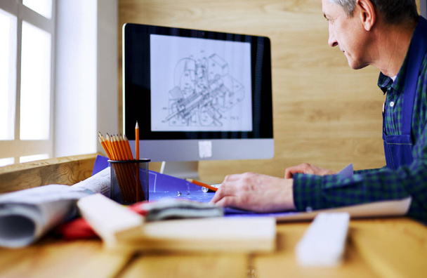 Architect working on drawing table in office - Foto, Imagem