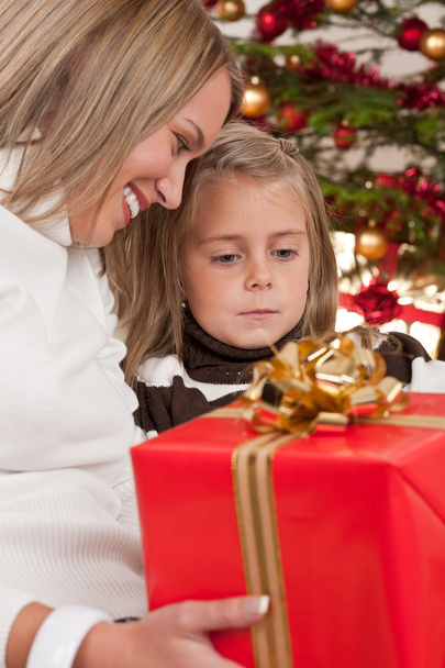 Happy blond woman with child on Christmas - Foto, Bild