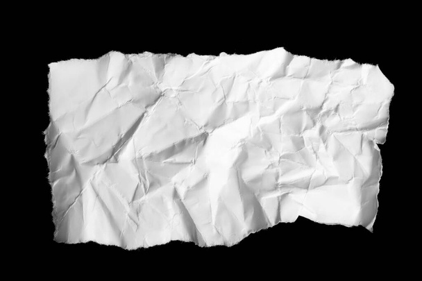 a white piece of paper on a black isolated background - Foto, afbeelding