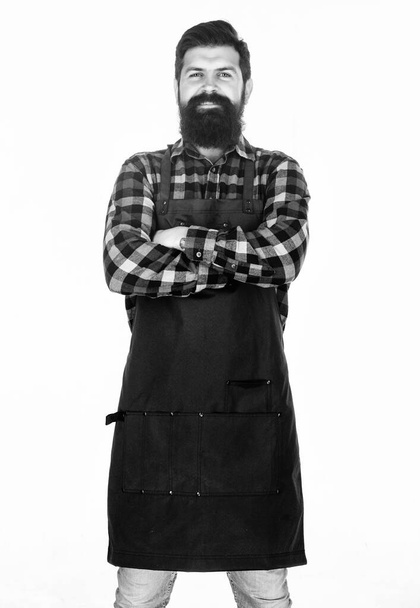 Keeping his arms crossed with confidence. Master chef isolated on white. Chef with long beard wearing bib apron. Barbecue in cooking apron with pockets. Bearded bbq chef in kitchen apron - Foto, imagen