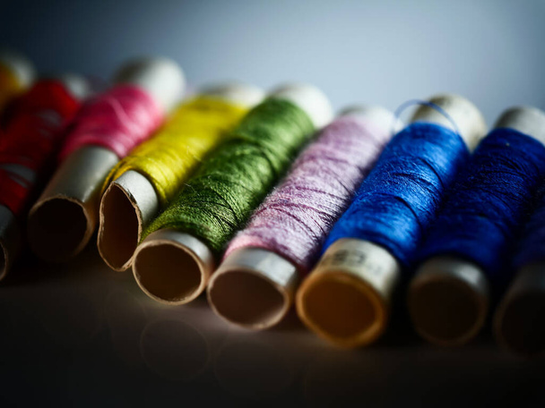 Sewing threads multicolored background closeup, selective focus, macro - Photo, Image