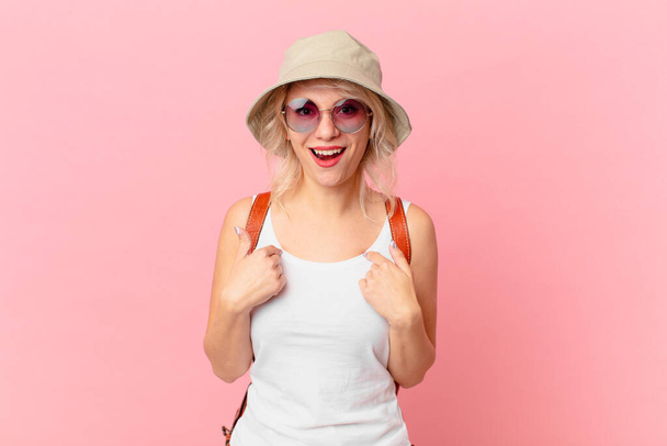 young pretty woman feeling happy and pointing to self with an excited. summer tourist concept - 写真・画像
