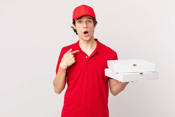 pizza deliver man feeling happy and pointing to self with an excited - Valokuva, kuva