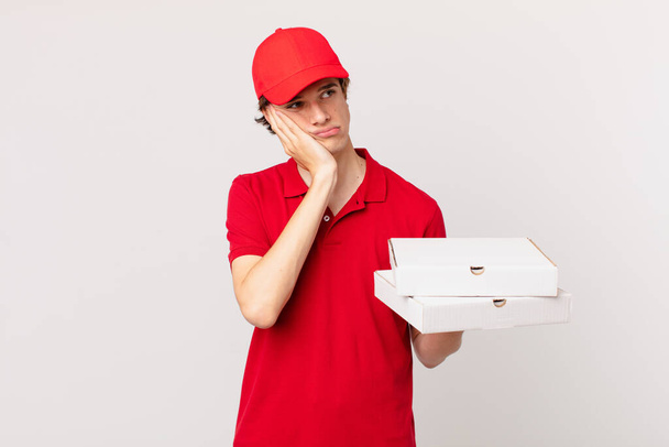pizza deliver man feeling bored, frustrated and sleepy after a tiresome - Fotoğraf, Görsel