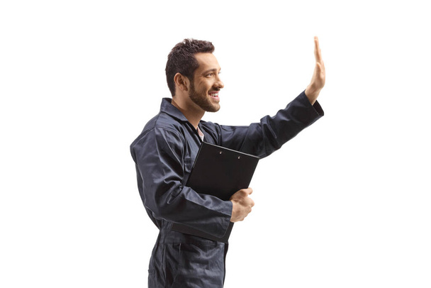 Auto mechanic worker gesturing with hand isolated on white background - Zdjęcie, obraz