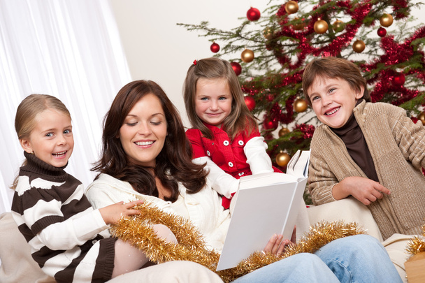 Happy family: mother with three children on Christmas - Zdjęcie, obraz