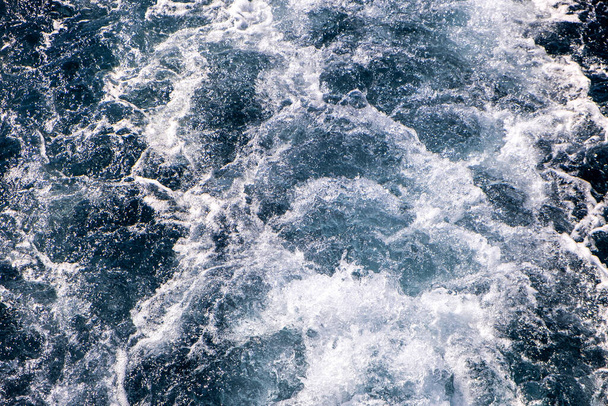 Top down aerial view of sea water surface. White foam waves texture as natural background. - Photo, Image