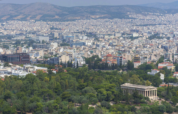View of the Athens and the ancient Temple of Hephaestus, a doric greek temple in the north-west side of the Agora of Athens, Greece. - Photo, Image