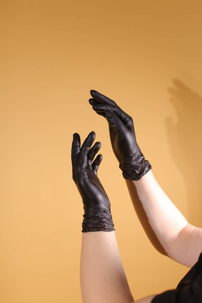 Black Surgical Latex Glove for hair dying salon - Photo, Image