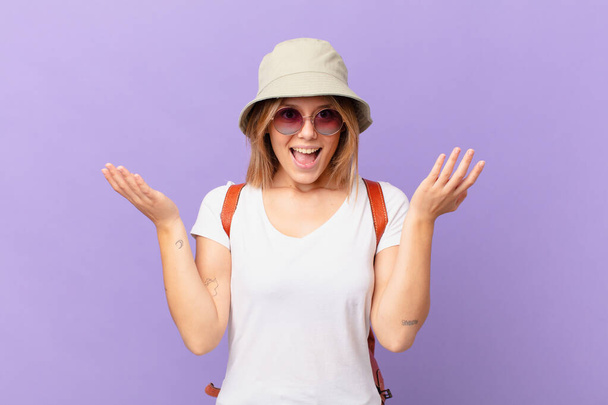 young traveller tourist woman feeling happy and astonished at something unbelievable - Photo, image