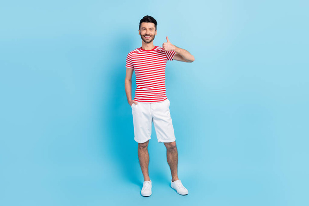 Full length photo of charming happy man show thumb-up approve isolated on pastel blue color background - Zdjęcie, obraz
