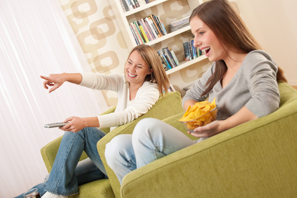 Students - Two female teenager watching television - Photo, Image