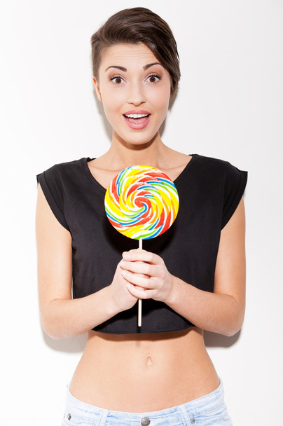 Woman holding big lollipop - Фото, изображение
