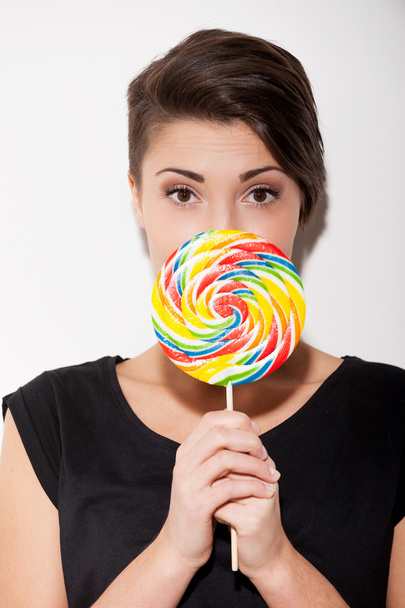Woman holding big lollipop - Foto, Imagem