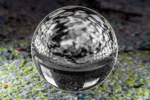 A closeup shot of a crystal ball reflecting the surroundings - Photo, image