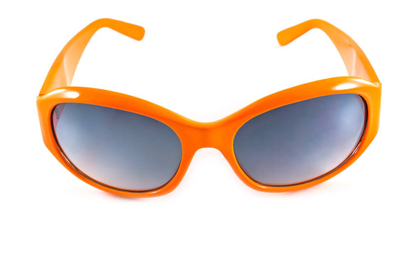 白い背景に隔離されたオレンジのサングラス - 写真・画像