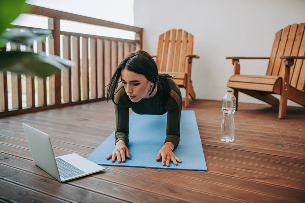 young beautiful woman doing yoga at home  - Фото, изображение