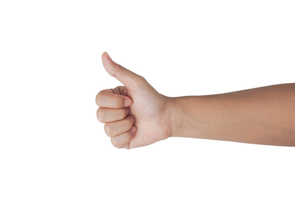 The woman shows the gesture of thumbs up with an arm isolated on white background with a clipping path. - Photo, Image