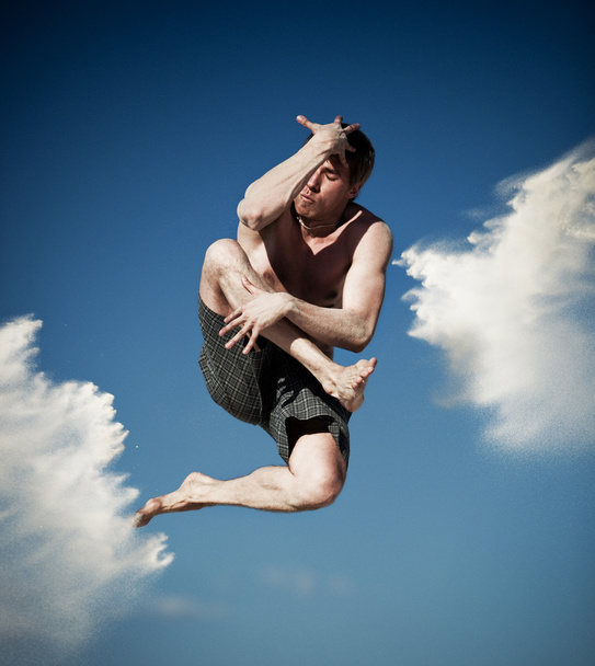Young man jumping on beach. Contrast colors effect. - Foto, imagen