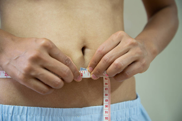Close up belly fat unheatly concept. - Photo, Image
