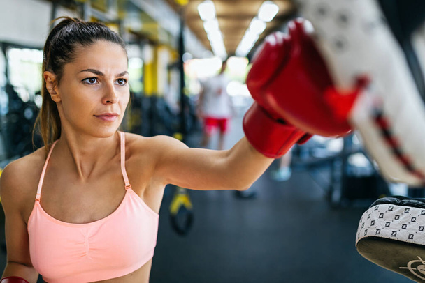 Close up portrait of happy fit woman exercising in gym. Healthy lifestyle, sport, people concept - Photo, Image