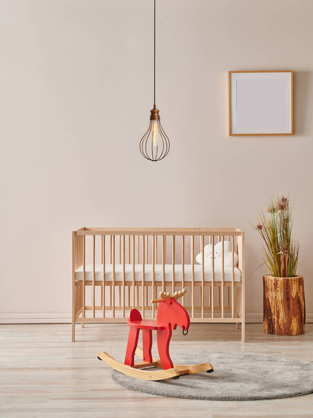 Modern baby room with wooden bed and lamp concept. - Photo, Image
