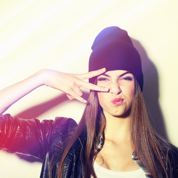 Hipster teenage girl with beanie hat pouting - Photo, Image