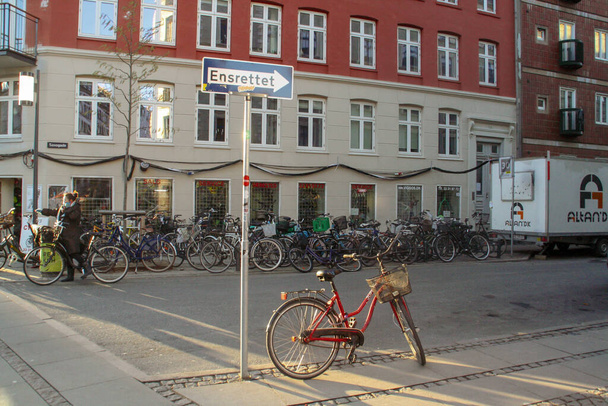 Copenhagen, Denmark; 02 15 2016. Bikes parked in Ensrettet street in Copenhagen. Usual image in the city in the Danish capital. - Foto, Bild