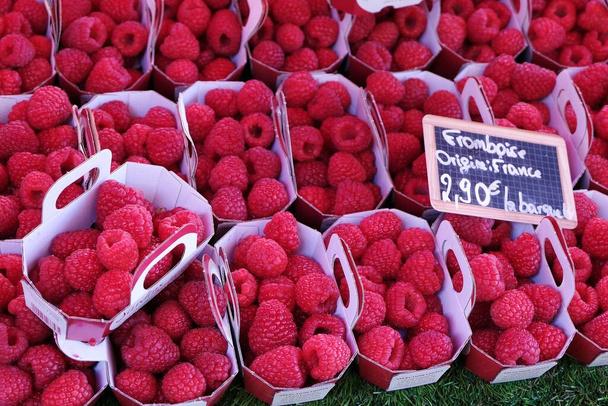 French market stall with trays of organic raspberries  - Photo, Image