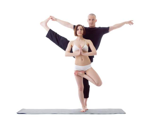 Attractive Europeans practicing yoga at camera - 写真・画像