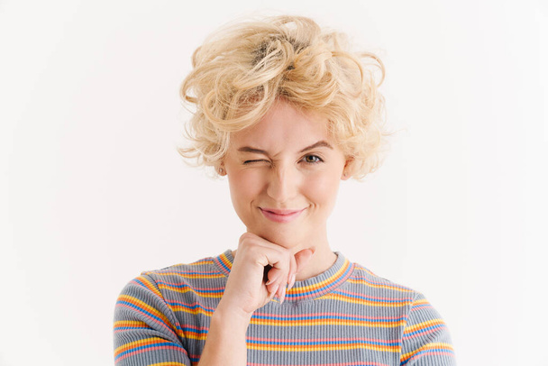 Image of cheerful curly woman isolated over white background and winking - Photo, Image