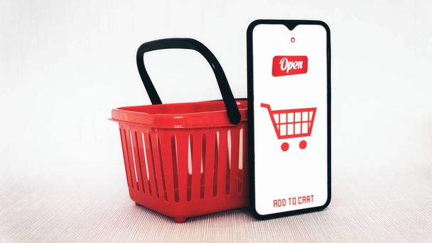スマートフォンや赤いショッピングバスケットオンラインショッピングやホームデリバリーのコンセプトモックアップ - 写真・画像