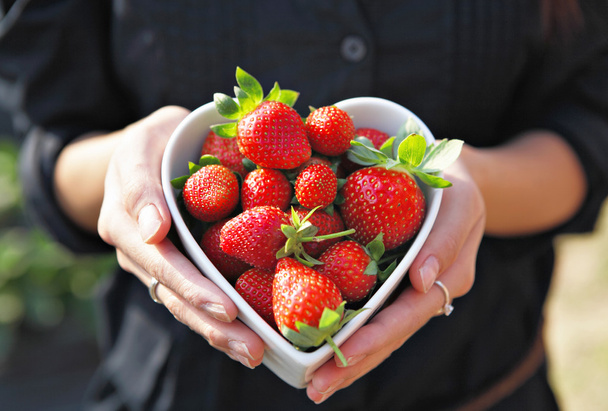Strawberries in heart shape bowl - Photo, Image
