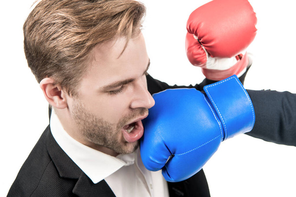 Lose situation. Businessman punched in face. Young man punched with boxing glove. Defeated in fight. Aggression and conflict. - Foto, imagen
