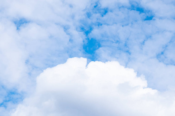 white airy porous cloud on blue sky with copy space - Photo, Image