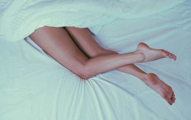 Female legs close up. Spa treatment for feet. Female legs on a white background - Foto, Imagem