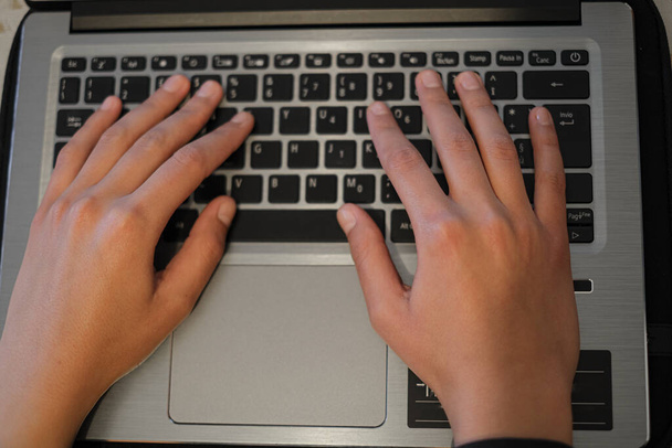 Top view of Woman hands view while using laptop for smart working,covid-19 pandemic  - 写真・画像