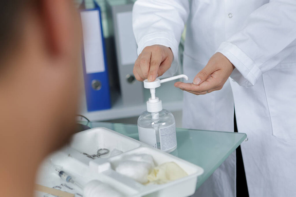 doctor using a hand gel - Фото, изображение