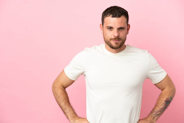 Young Brazilian man isolated on pink background angry - Photo, Image